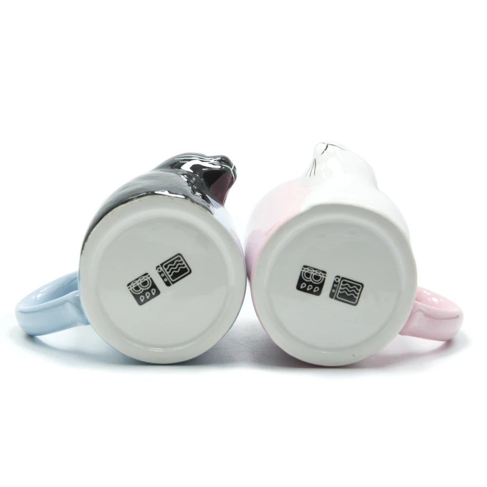 Two 3D ceramic cat couple mugs with kissing faces