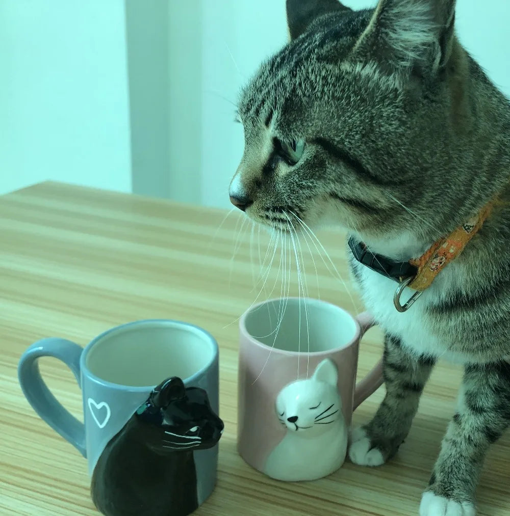 Two 3D ceramic cat couple mugs with kissing faces