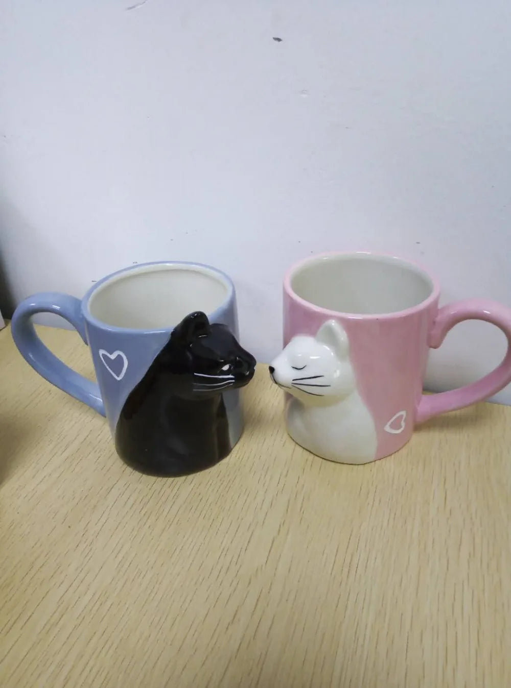 Two 3D ceramic cat couple mugs with kissing faces