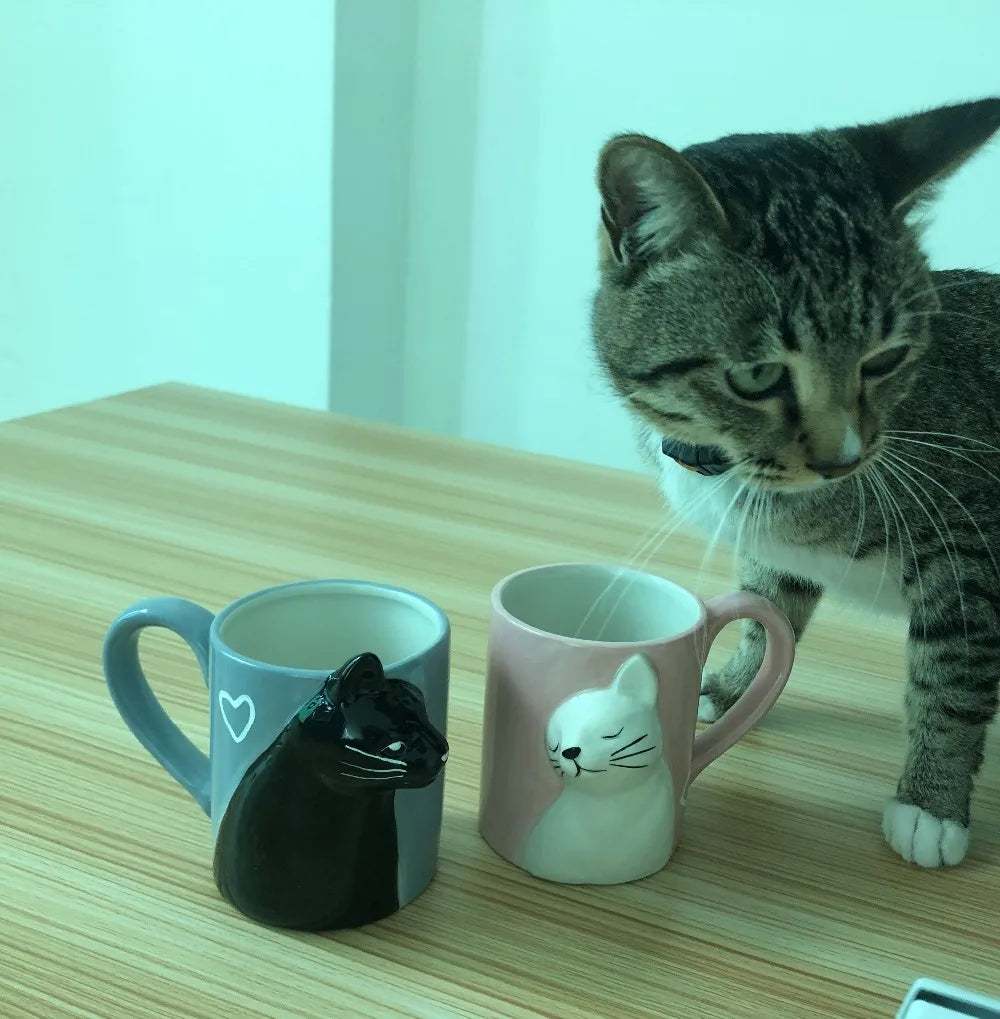 Two 3D ceramic cat couple mugs with kissing faces