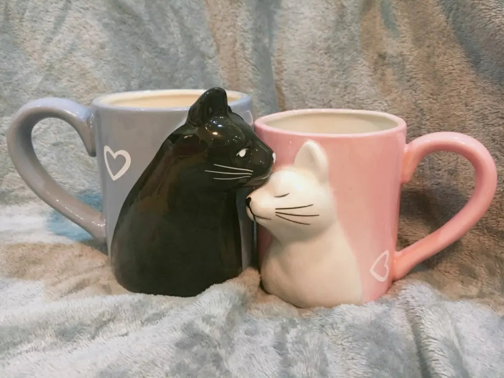 Two 3D ceramic cat couple mugs with kissing faces