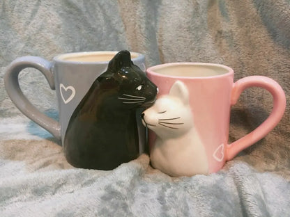 Two 3D ceramic cat couple mugs with kissing faces