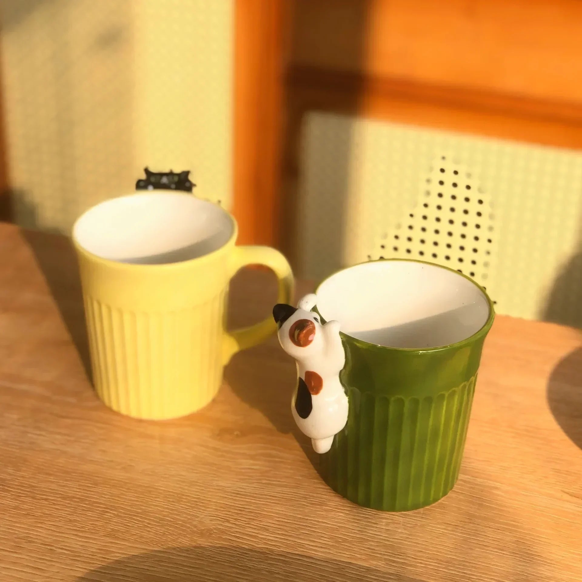 Stackable ceramic mug with cartoon cat design